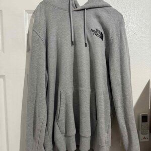 North face zip up hoodie HAS A SMALL HOLE